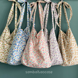 ภาพขนาดย่อของภาพหน้าปกสินค้ารวมกระเป๋าผ้าน่ารัก ลายดอกไม้ สายผูกโบว์ totebag  สีเยอะมาก จากร้าน sambaitaocase บน Shopee ภาพที่ 6