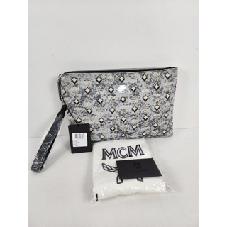 MCM Medium Wristlet Pouch in Vintage Monogram Jacquard  crafted of Visetos monogram vintage denim jacquard. Smooth nappa