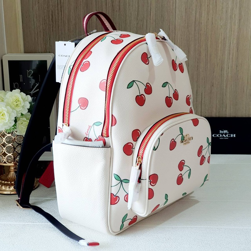 สด-ผ่อน-เป้-10-นิ้ว-เป้กลางสีขาวเชอรี่-coach-ce628-court-backpack-with-heart-cherry-print