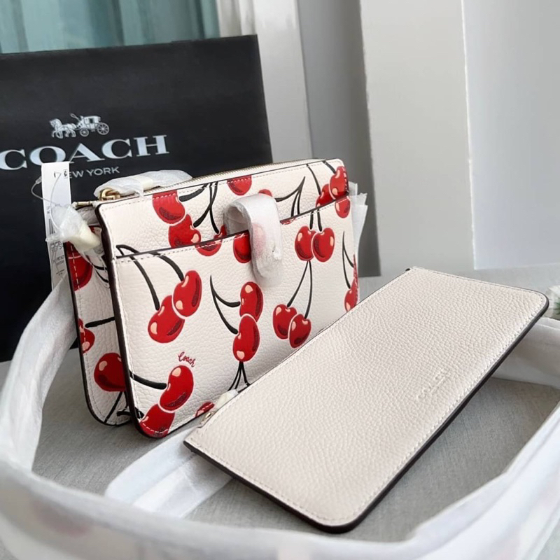 ผ่อน0-กระเป๋าสะพายข้าง-coach-noa-pop-up-messenger-with-cherry-print-ca799-งานshop-สีขาว-ลายเชอรี่แดง-ใส่โทรศัพท์