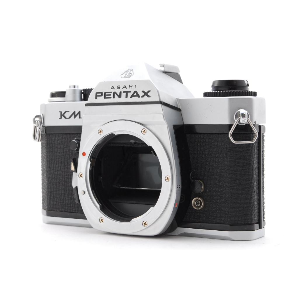 REFLEX ARGENTIQUE ASAHI PENTAX KM 35mm + SANGLE/BOUCHON - LIRE/TEL QUEL