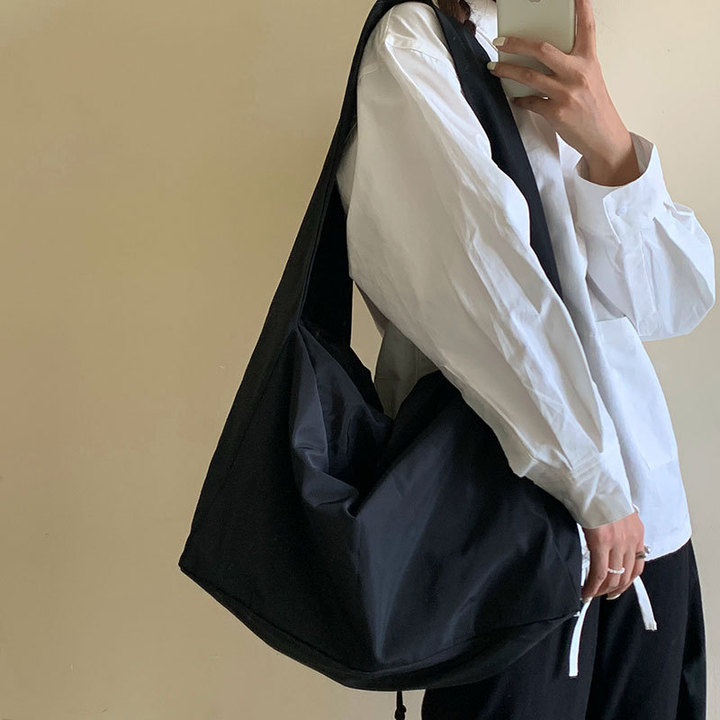 messenger-กระเป๋า-casual-cool-สไตล์ฮ่องกงผ้าใบขนาดใหญ่กระเป๋าผู้หญิงเกาหลีรุ่นขนาดใหญ่ความจุไนลอนอเนกประสงค์-harajuku-นักเรียน