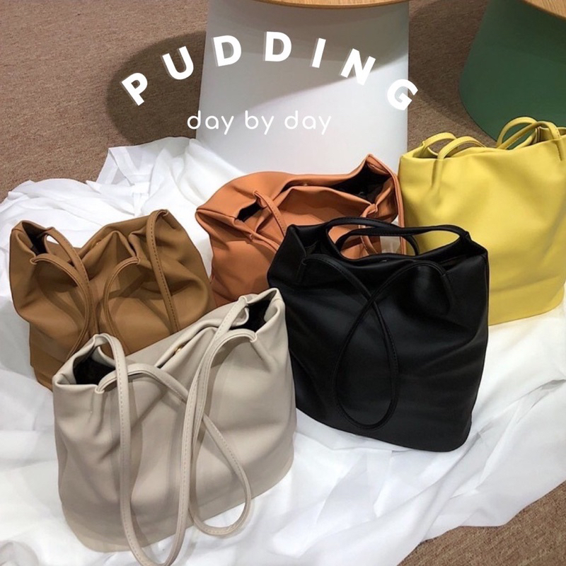 ภาพหน้าปกสินค้า( เหลือ 275) PUDDING BAG กระเป๋า everyday bag ที่ถูกต้อง :) ใส่ IPAD ได้ สีสวยละมุน จากร้าน daybyday.bag บน Shopee