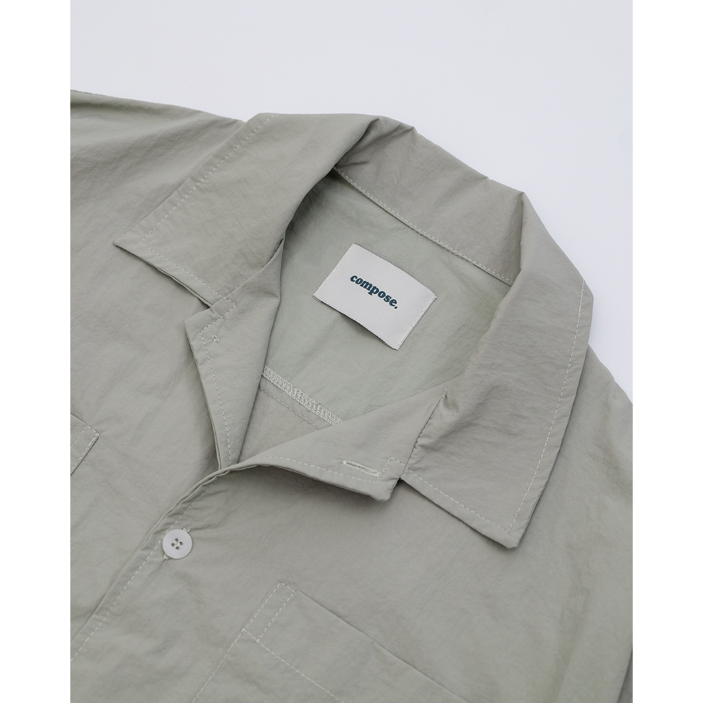 ภาพสินค้าNylon L/S Shirt in Sage Green  เสื้อเชิ้ตแขนสั้นผ้าไนล่อนสีเขียวเซจ จากร้าน compose.compose บน Shopee ภาพที่ 7
