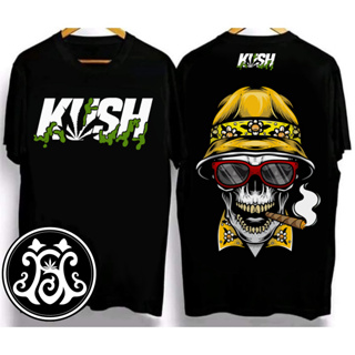 KUSH T-shirt คอกลม ผ้าฝ้ายพิมพ์ลาย หัวกระโหลกสูบ ลายไดโนเสาร์