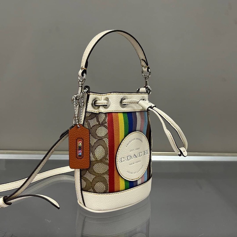 coach-cj661-mini-dempsey-bucket-bag-in-signature-jacquard-with-rainbow-stripe-and-coach-patch