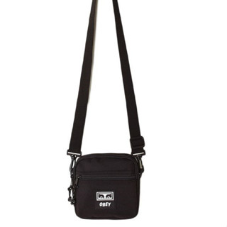 OBEY กระเป๋าเป้สะพายข้าง รุ่น CONDITIONS TRAVELER BAG III สี BLACK