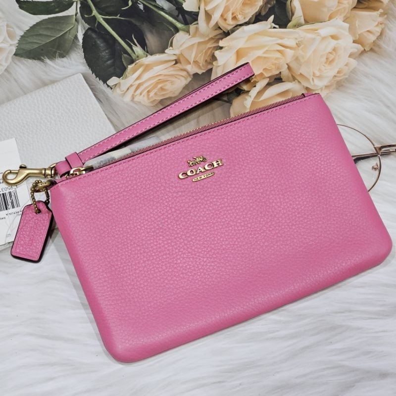 ของแท้-100-new-พร้อมส่ง-กระเป๋าคล้องข้อมือ-coach-wristlet-สีชมพู