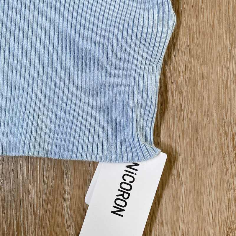 เสื้อไหมพรมสีฟ้าป้ายnicoron