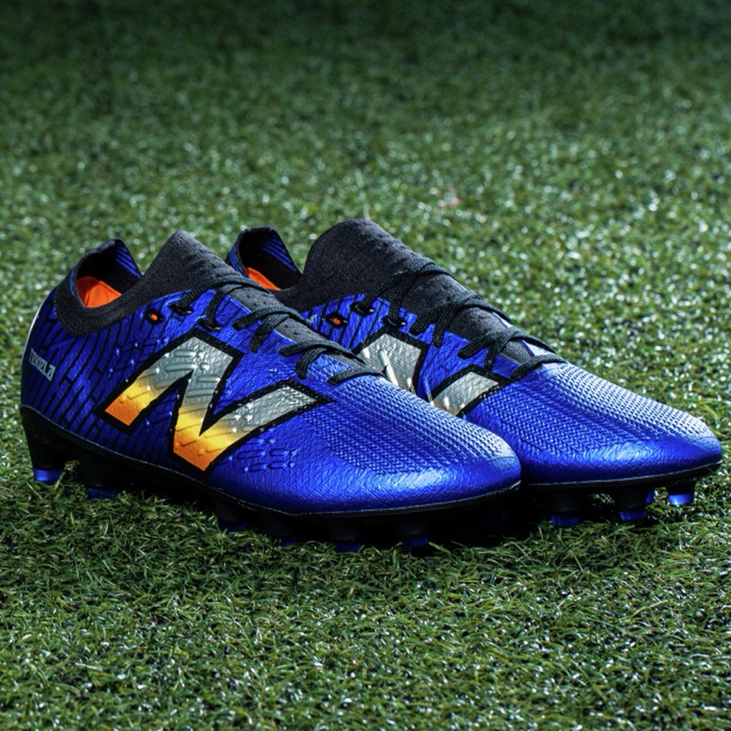 NEW BALANCE TEKELA V4+ PRO LACED LOW HG สีน้ำเงิน รองเท้าฟุตบอล