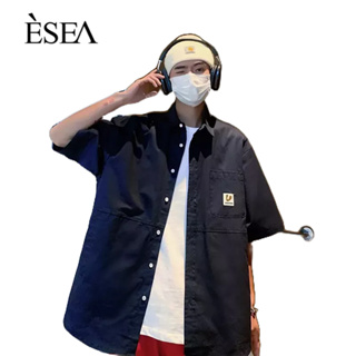 ESEA เสื้อเชิ้ตผู้ชายทรงหลวมสบาย ๆ เสื้อเชิ้ตผู้ชายแขนสั้นสไตล์ฮาราจูกุยอดนิยมเรียบง่าย